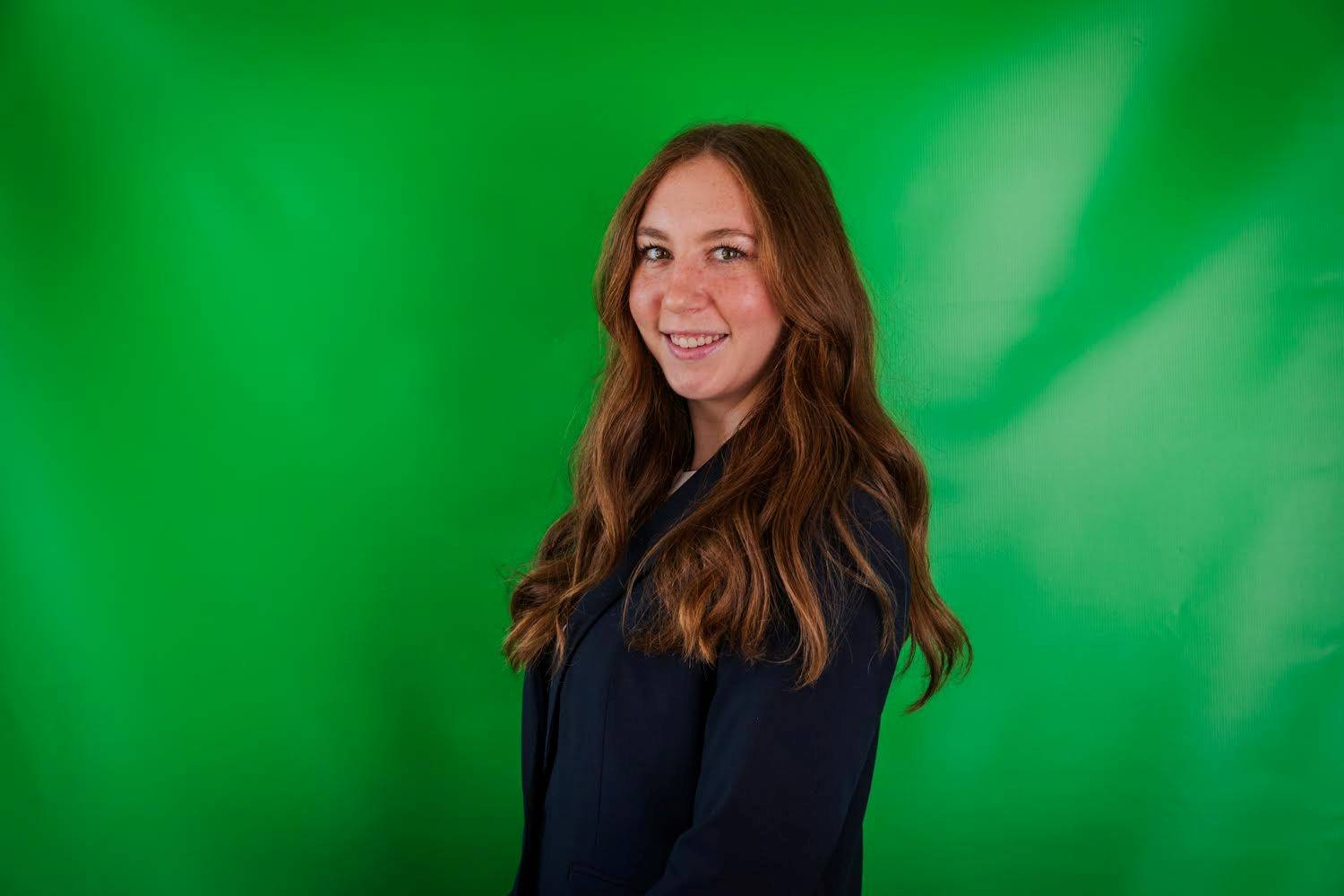 Student Manager Ailis Nerad is standing with a green background.