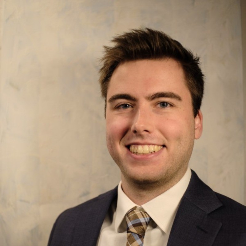 Extern Danny Kennedy smiles in a headshot.