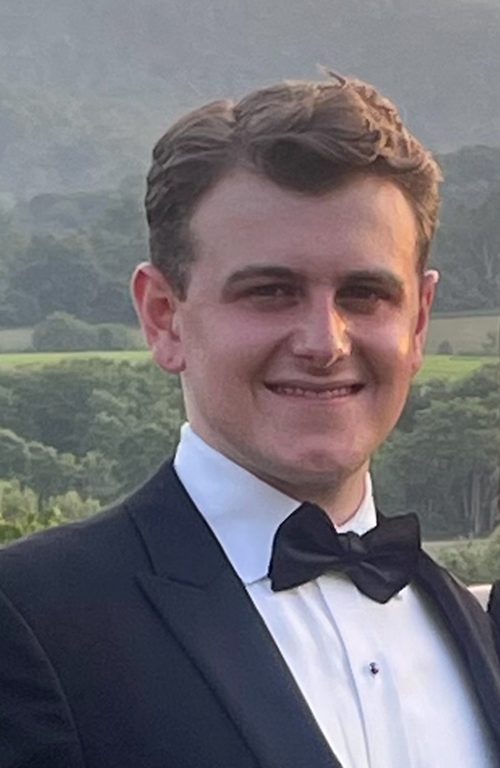 Extern Luc Kaiser smiles in a headshot.