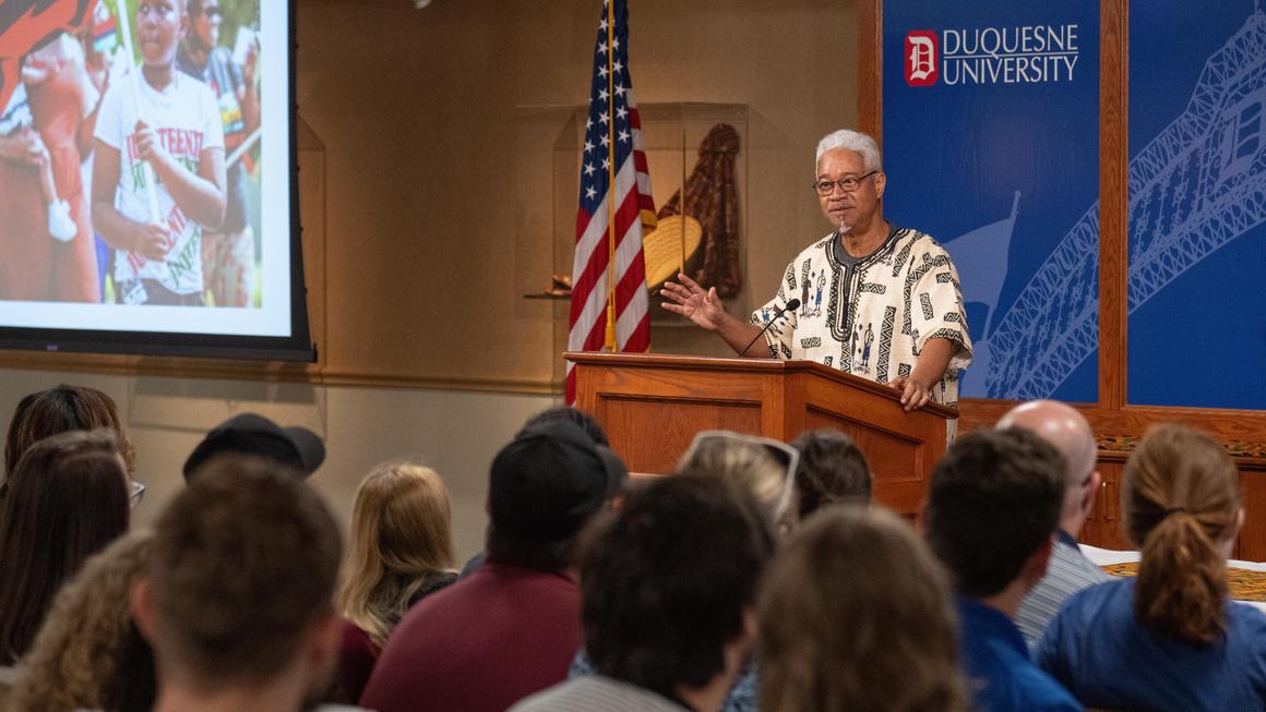 Dr. Gerald Boodoo, director of the Center for African Studies addresses the audience