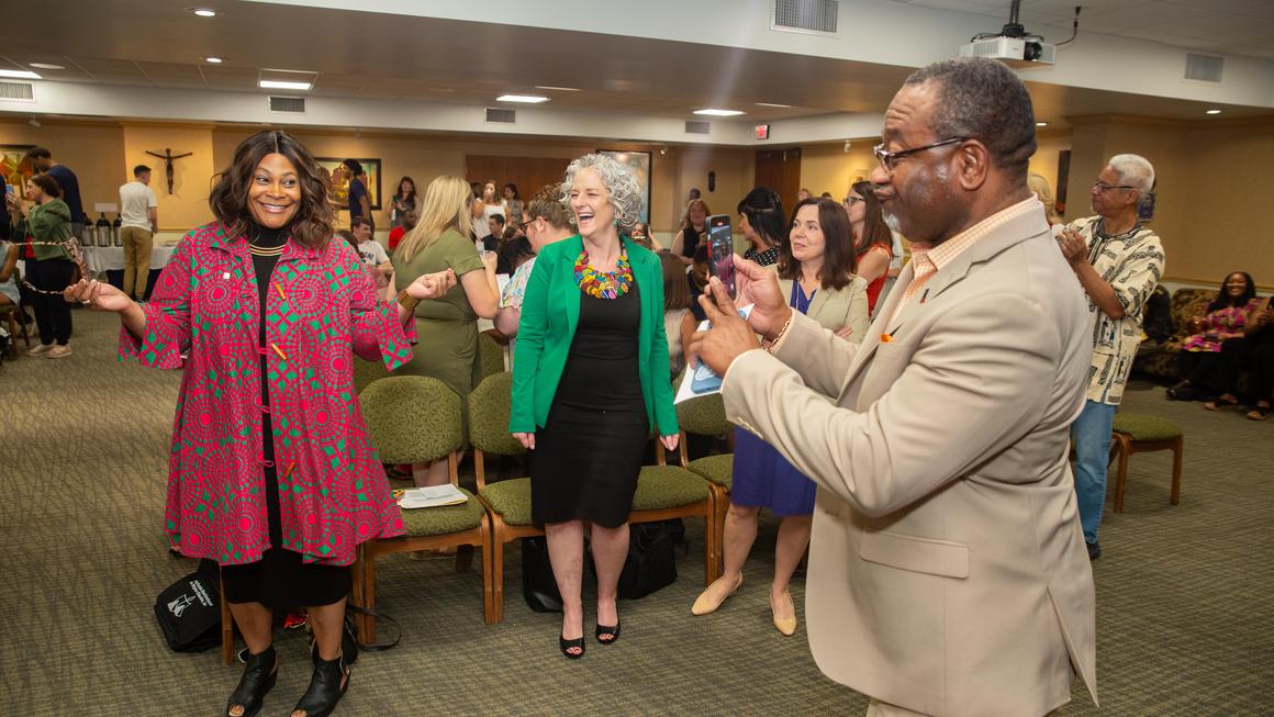 Crystal McCormick Ware and Dr. Leanna Fenneberg dance during the steel drum performance at Juneteenth 2024.